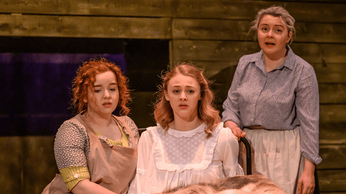 A still from the Lyric Drama Studio's production of Dracula, featuring three female actors.