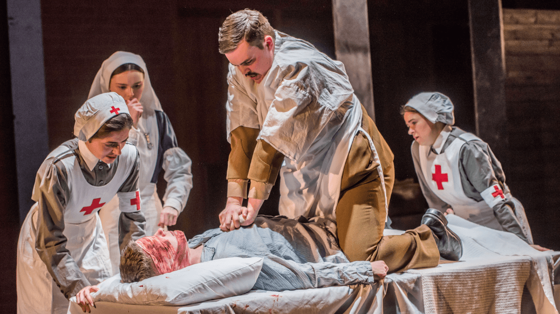 A still from the Lyric Drama Studio's production of Dracula, featuring five actors on stage.