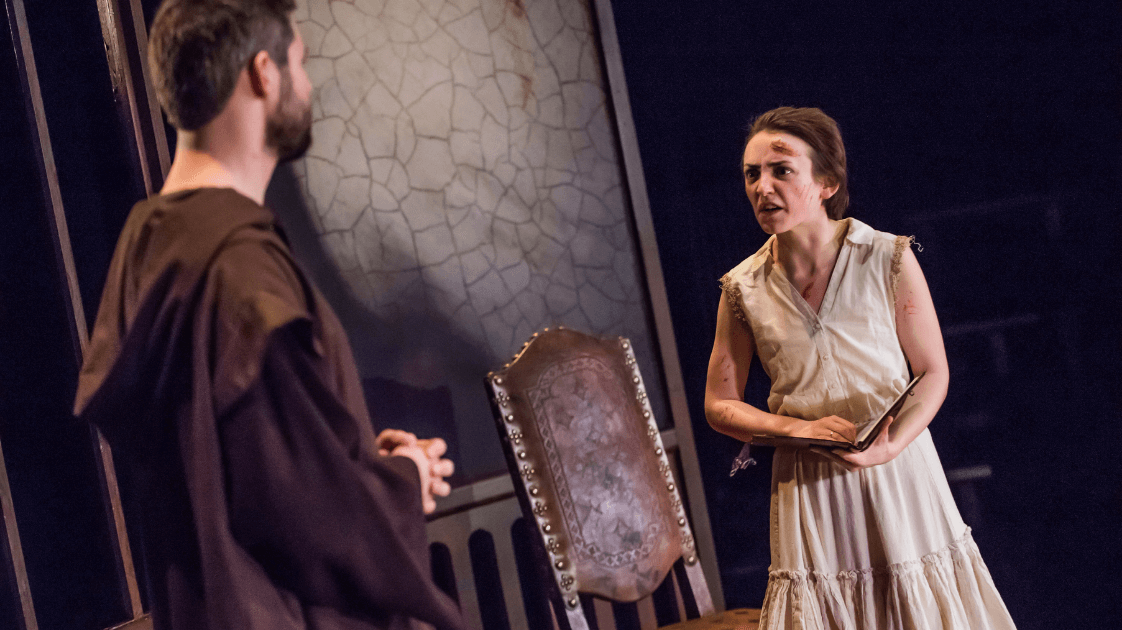 A still from the Lyric Drama Studio's production of Dracula, featuring two actors on stage.